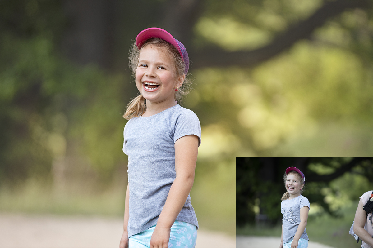 Laughing cute little girl with baseball cap