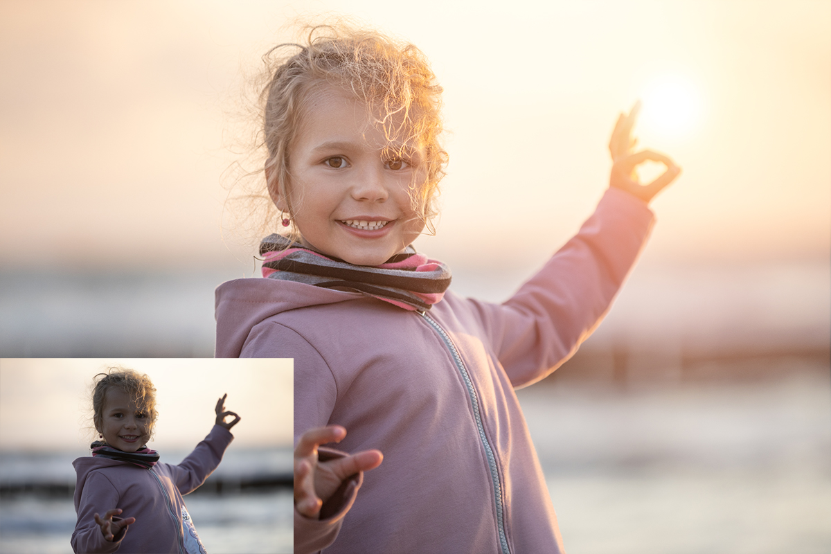 Smiling little girl on sunset baltic beach.